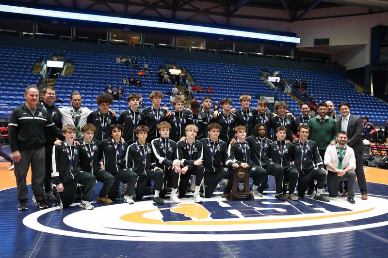 Providence Catholic poses with the IHSA Class 2A Dual Team State runner-up trophy following their loss to IC Catholic in the championship on Saturday, Feb. 28, 2026.