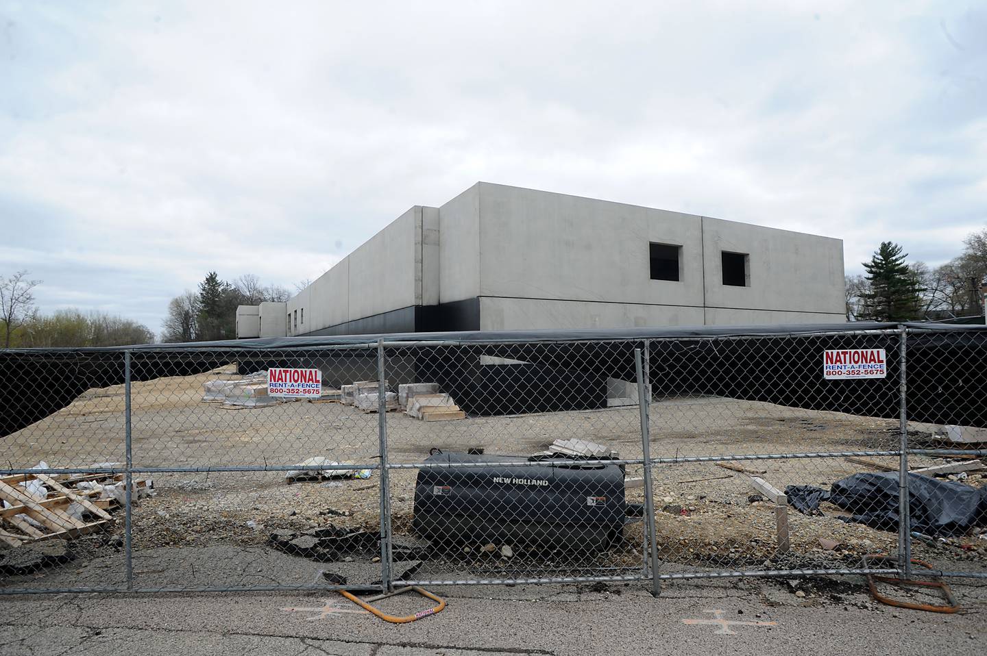 The foundation walls of a five-story, 100-unit apartment building in downtown Fox River Grove on May 2, 2022. Work has stopped on the building after developers received a demolition permit in August and a limited permit in November that allowed the construction of footings for the building and foundation walls. That work is now complete and work cannot continue until the village signs off on the final plans.