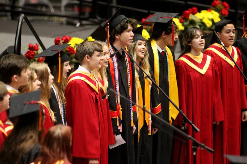 Choir members perform during the 2022 Batavia High School Commencement Ceremony at the Northern Illinois University Convocation Center in DeKalb on Wednesday, May 25, 2022.