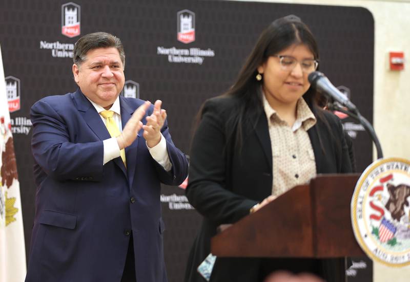 Illinois Gov. JB Pritzker applauds as Northern Illinois University student Lorena Nava-Moyoti comes to the podium Thursday, March 3, 2022, in the Barsema Alumni and Visitors Center at NIU in DeKalb. Pritzker was visiting NIU to talk about the importance of higher education and to tout the programs in Illinois that make that education more accessible to all.