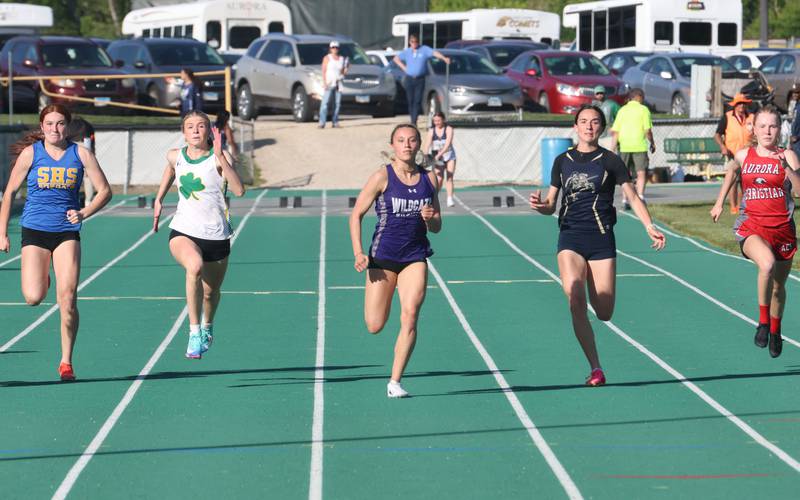 (From left) Somonuak's Ella Roberts, Seneca's Eila Coleman, Wilmington's McKenna Van Tilburg, Marquette's Madisyn Trainor, and Aurora Christian's Grace Knight compete in the 100 meter dash during the Class 1A Sectional meet on Thursday, May 14, 2026 at Seneca High School.