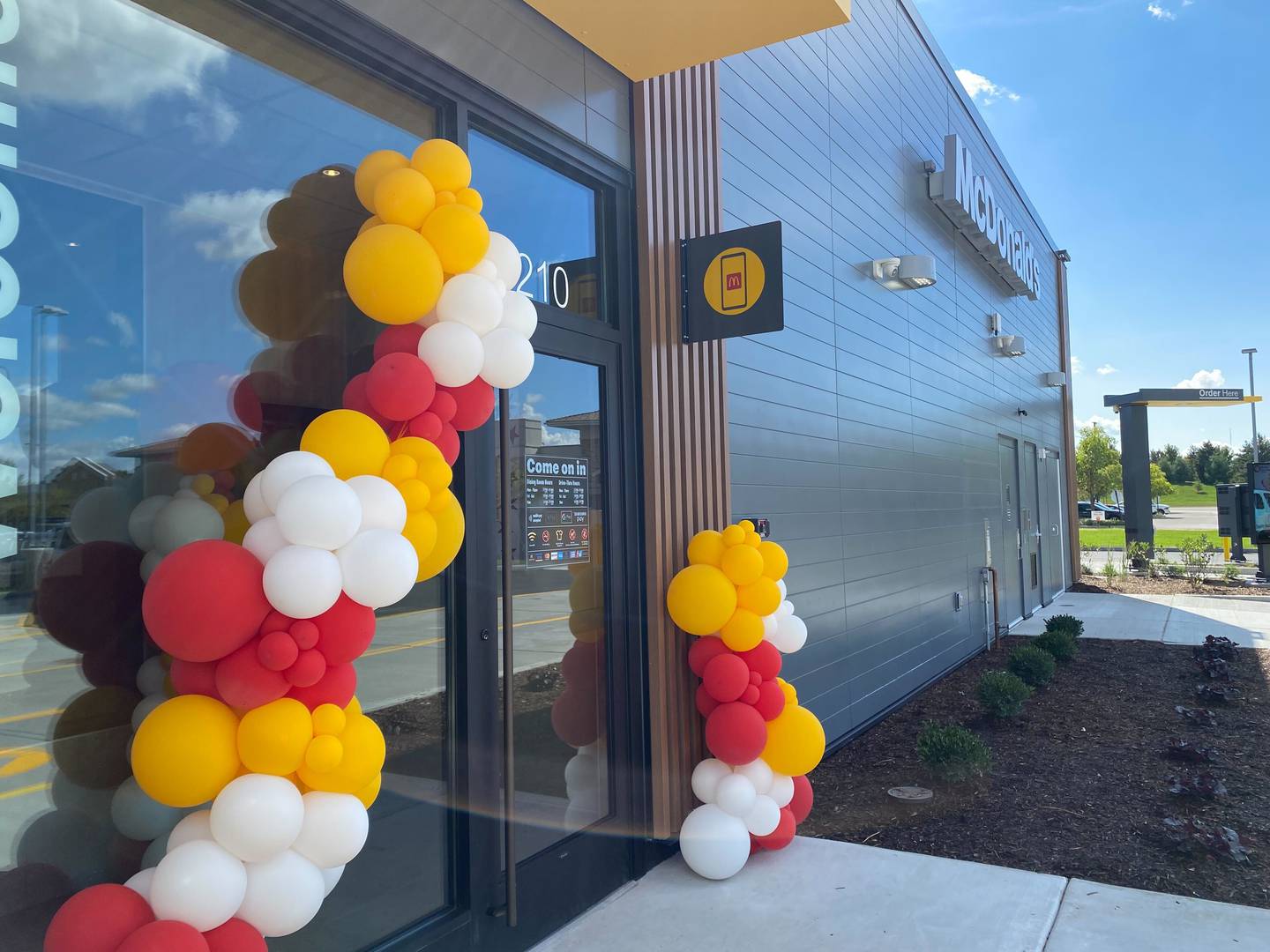 Balloons at the entrance celebrate the opening on Thursday, Sept. 25, 2025, of a new McDonald's at the corner of Plank Road and Illinois Route 23 in Sycamore.