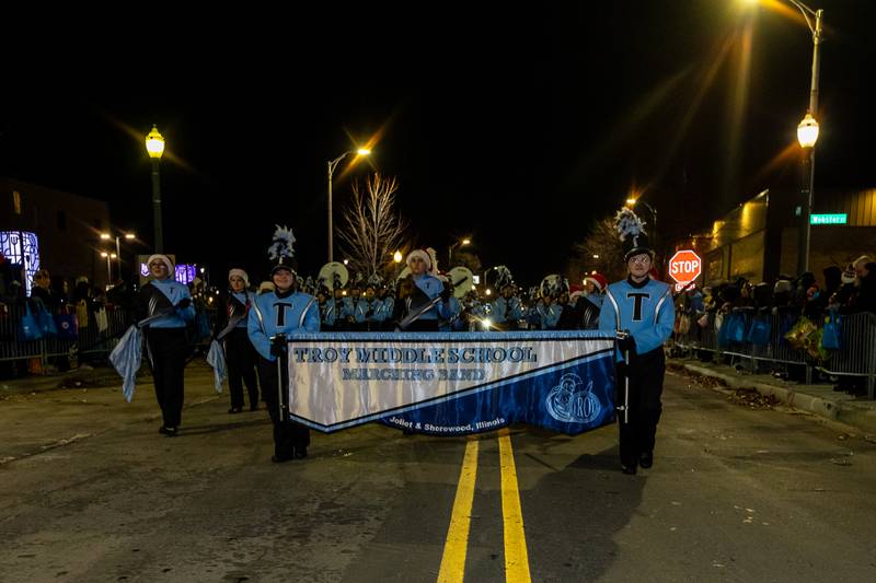 The Troy Middle School Marching Band performs during the Light Up the Holidays Parade in Downtown Joliet on Nov. 28, 2025.