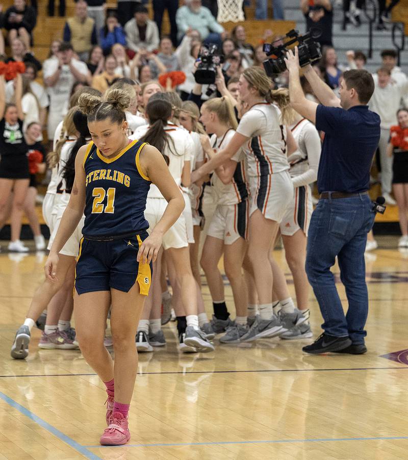 Sterling’s Jae James comes off the court as Washington celebrates their win over the Warriors Monday, March 3, 2025, during the 3A Supersectional at Rochelle High School.