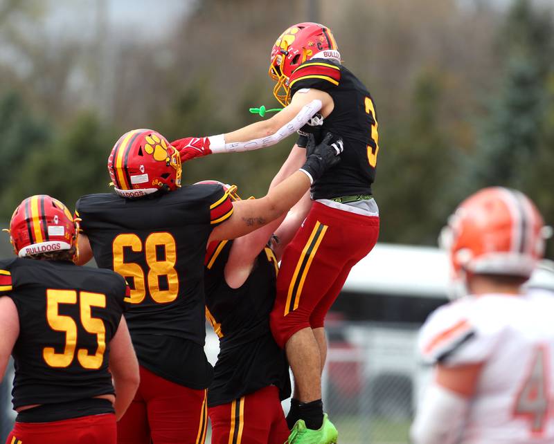 Batavia’s Ryan Whitwell celebrates his touchdown with teammates during their Class 7A second-round playoff game in Batavia against Hersey on Saturday, Nov. 5, 2022.