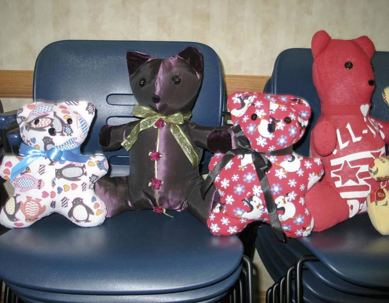 A collection of memorial care bears, all handmade by Joliet Area Community Hospice volunteers, are ready for their new homes.
