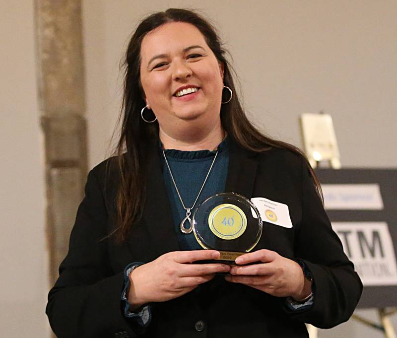 Jenilyn Roether, Voice Instructor and Director of Choral Activities, Illinois Valley Community College & Illinois Valley Youth Choir poses for a photo with her award during the Illinois Valley Chamber of Commerce 40 Under Forty Awards Gala on Thursday, Feb. 9, 2023 at Westclox in Peru.