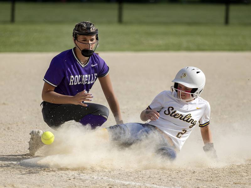Sterling’s Madison Birdlsey slides in safe at third against Rochelle’s Audrina Rodriguez Tuesday, May 27, 2025, during a Class 3A Regional softball game in Dixon.