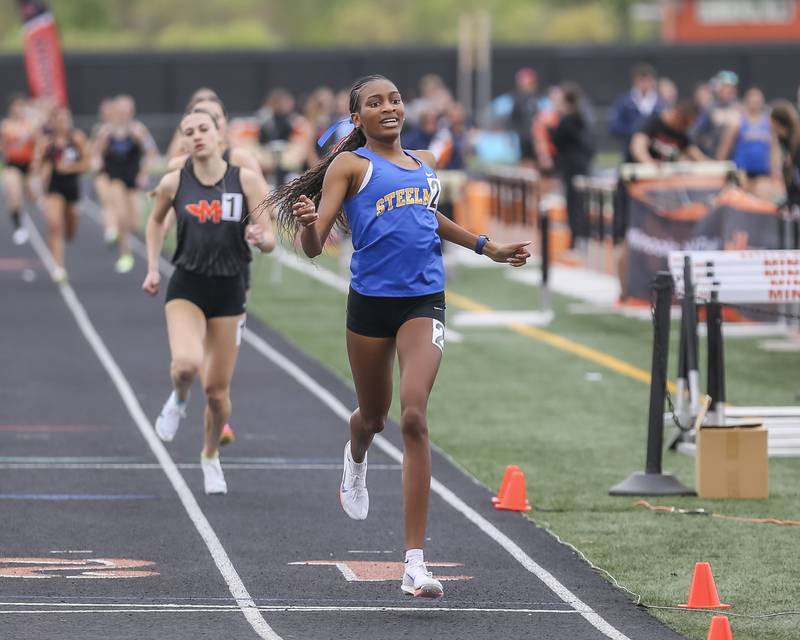 Joliet Central's Madison King (2) wins the 800m during Southwest Prairie Conference Girls Track and Field Meet Wednesday, May 7, 2025 in Minooka.