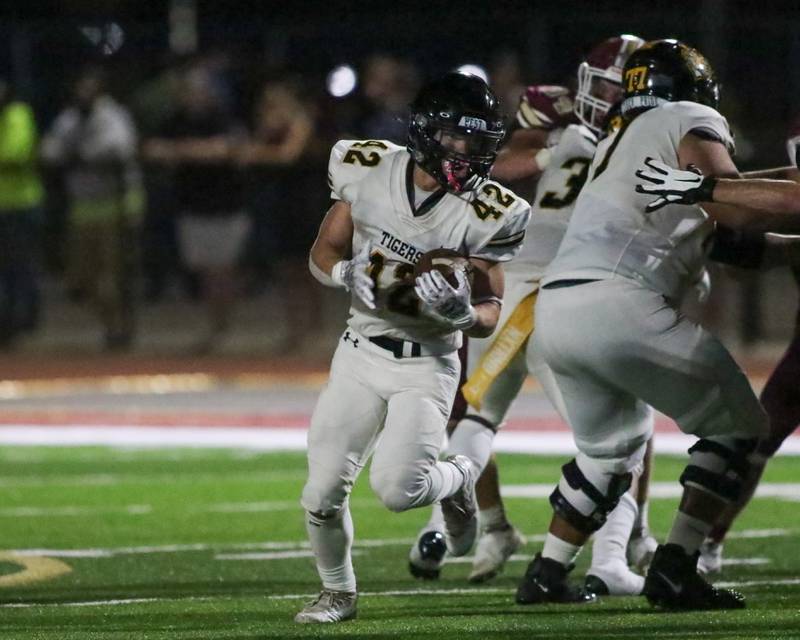 Joliet West's Gavin Garcia (42) runs with the ball during football game between Joliet West at Morris.  Sept 1, 2023.