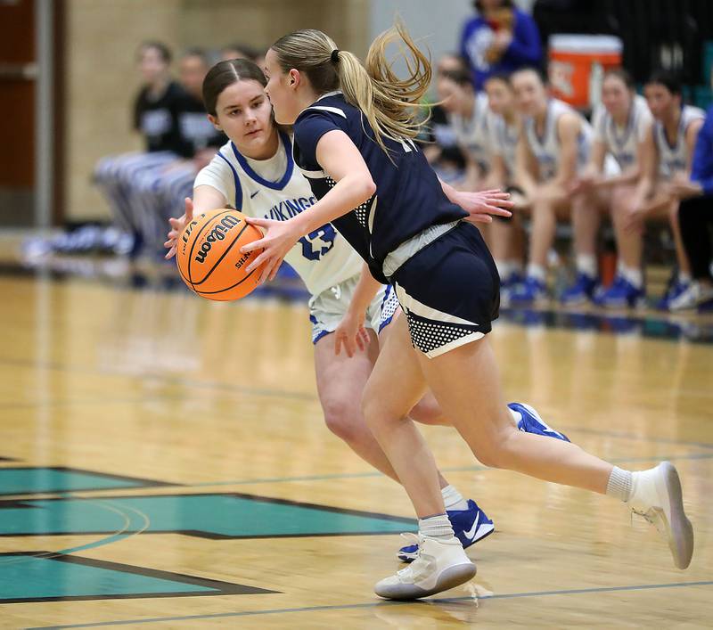 Geneva's Nora Hatton tries to steal the ball from St. Viator's Kalin McCrea during the IHSA Class 3A Woodstock North Supersectional girls basketball game on Monday, March 2, 2026, at Woodstock North High School.