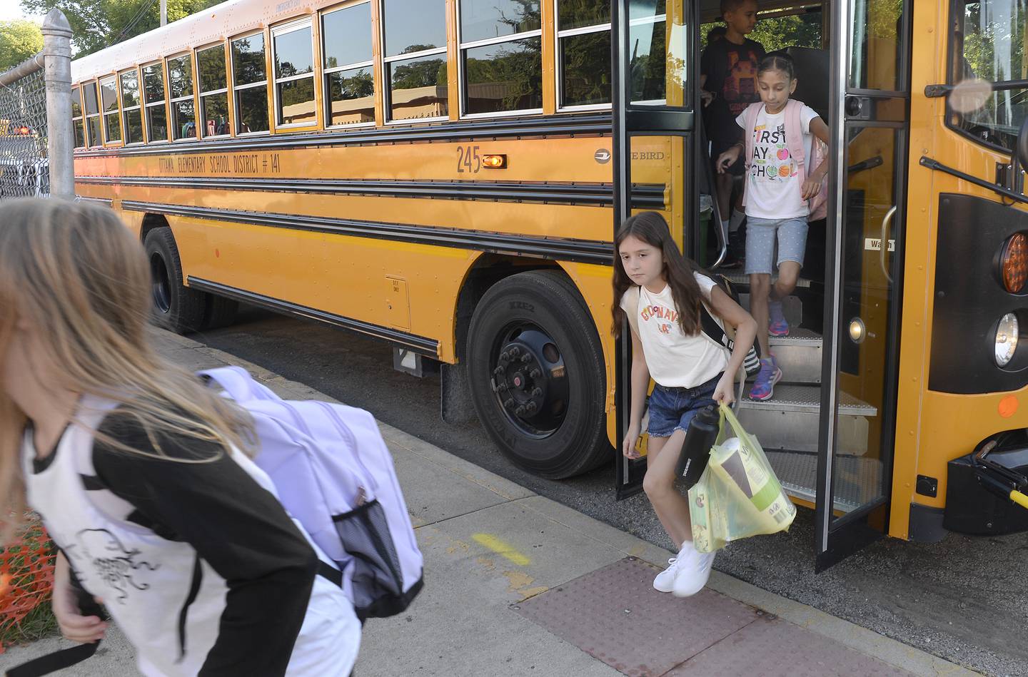 The school busses empty Wednesday, Aug. 31, 2022, as students arrive for the first day of class at McKinley School in Ottawa.