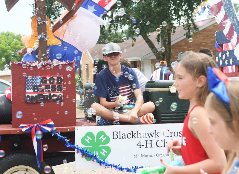 The Blackhawk Crossing 4-H Cub float offered bubbles and flavored ice treats out flavored ice treats during the Let Freedom Ring Grand Parade on July 4.