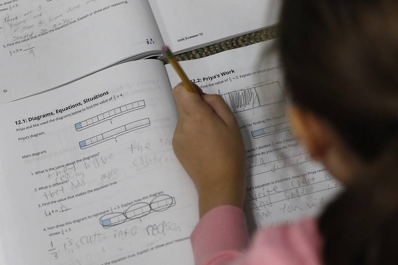 Fifth-grader Eliona Ahmedi solves a math problem Wednesday, Oct, 26, 2022, during a math class at Conley Elementary School, 750 Dr. John Burkey Drive in Algonquin.