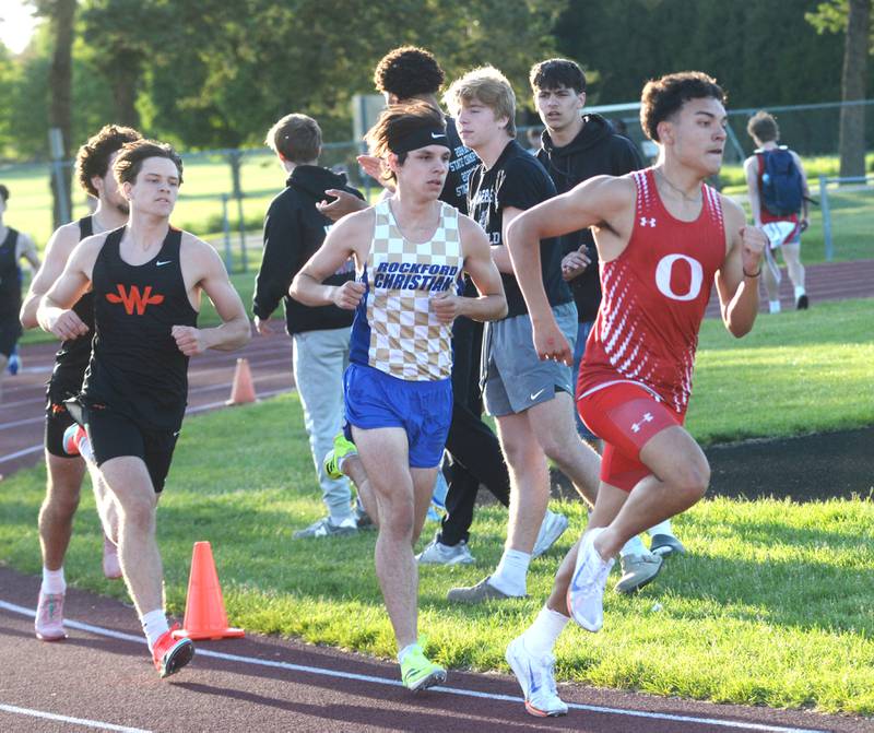 Oregon's Daniel Gonzalez (right) leads Rockford Christian's Evan White (center) on the second turn of the 800 run at the 1A Oregon Sectional at Landers-Loomis Field on Friday, May 23, 2025. Gonzalez finished second in the race and White finished first with both advancing  to the state meet at Eastern Illinois University on Thursday, May 29.
