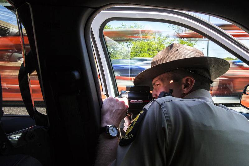 Trooper Dan Kenshol runs radar on Thursday, May 23, 2019, on Interstate 55 in Joliet, Ill. Scott's Law is named after Lieutenant Scott Gillen of the Chicago Fire Department who was struck and killed by an intoxicated driver while assisting at a crash. It requires drivers approaching police or emergency vehicles who are stopped on the roadway to reduce speeds, proceed with caution and switch lanes, if possible.