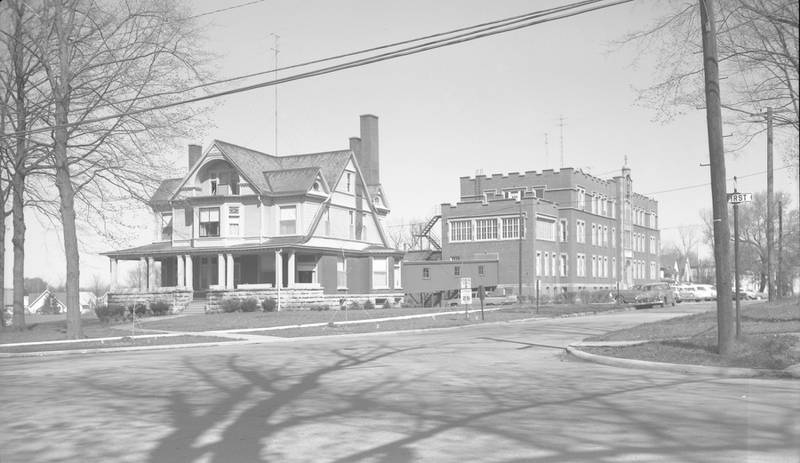 First and Fisk streets in DeKalb, looking northeast at the former Edward C. Lott house and St. Mary's hospital, in 1963. The Lott house was demolished in May 1974.