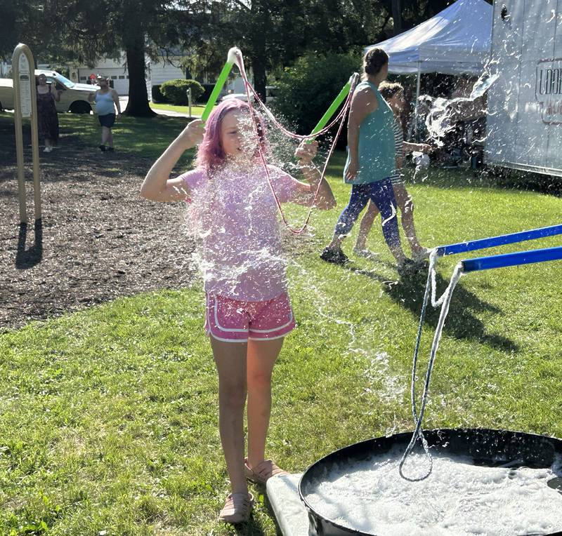 Kiana Steffa, 12, of Oregon, has her big bubble burst at German Valley Days on Saturday, July 19, 2025. The "Bubble Guy", Jason Kollom of Niles, provided the fun which was one of the kids activities during the festival.