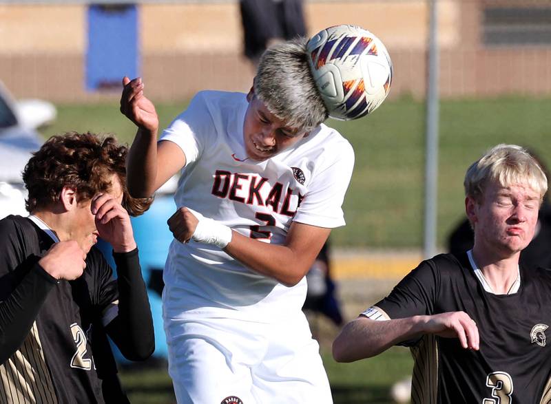 DeKalb's Jonathan Contreras heads the ball in front of the Sycamore goal on a corner kick during the El Classicorn rivalry game Tuesday, Oct. 7, 2025, at Sycamore High School.