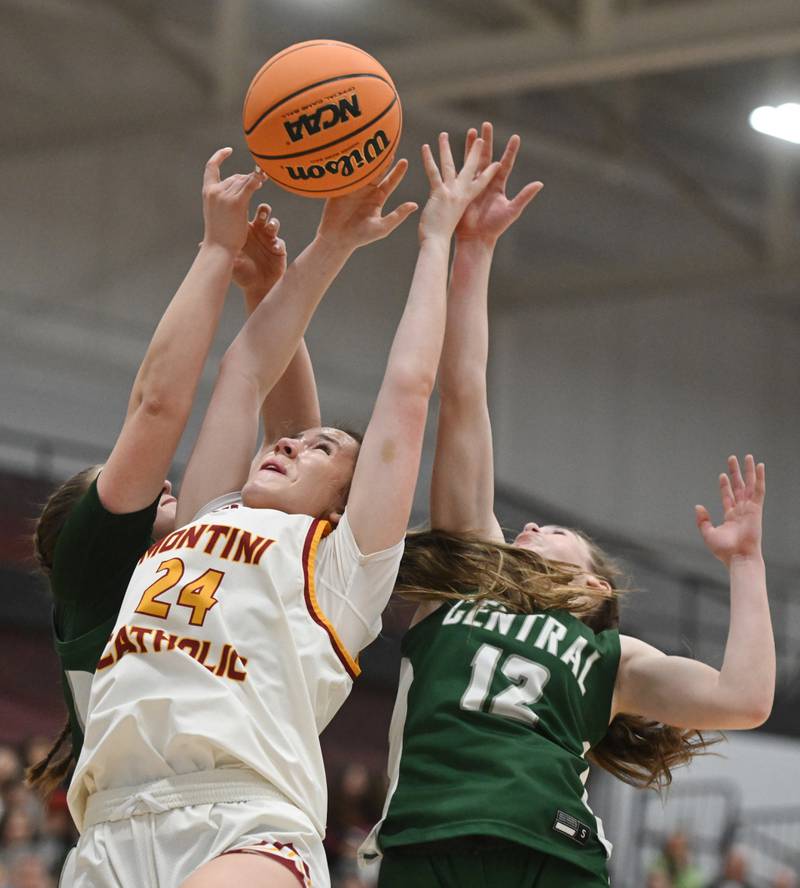 Montini's Peyton Farrell, middle, goes for a rebound against Grayslake Central's Annie Wolff, left, and Autumn Aliff during the Hersey Class 3A supersectional on Monday, March 3, 2025 in Arlington Heights.