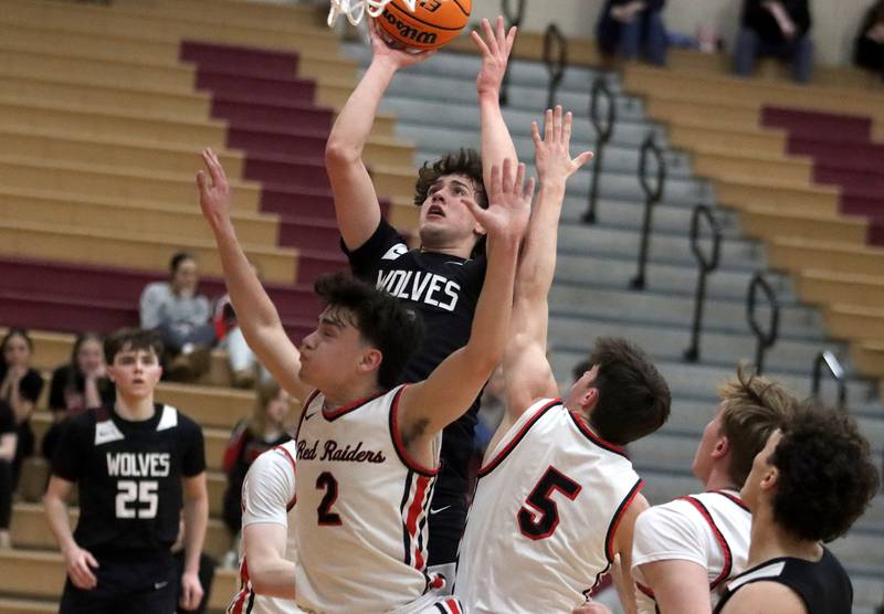 Prairie Ridge’s Ben Gablenz works under the hoop in varsity boys basketball on Tuesday, Feb. 18, 2025, at  Huntley High School in Huntley.