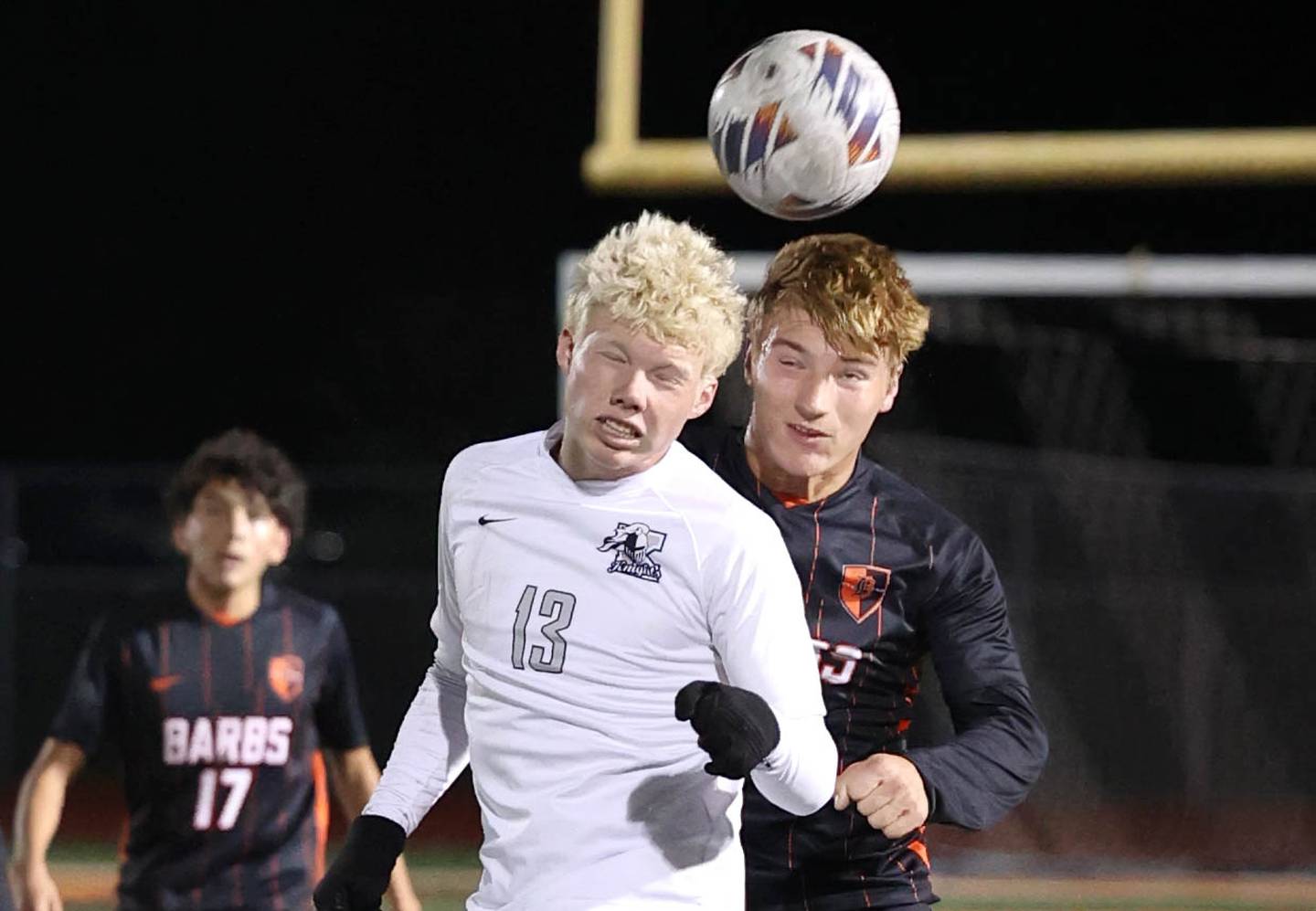 Kaneland's Sam Keen and DeKalb’s Sean Kolkebeck go up for a header during their game Thursday, Oct. 12, 2023, at DeKalb High School.