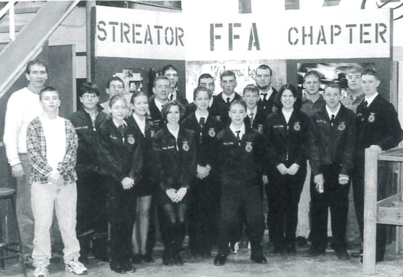 Streator FFA members in the 2000s pose for the annual picture in the old Ag Shop.