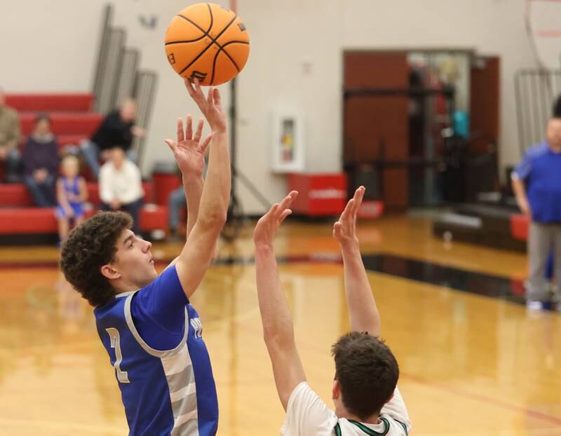 Princeton's Stihl Brokaw lets go of a shot over Eureka's Connell Roth during the Colmone Classic on Thursday, Dec. 11, 2025 at Hall High School.
