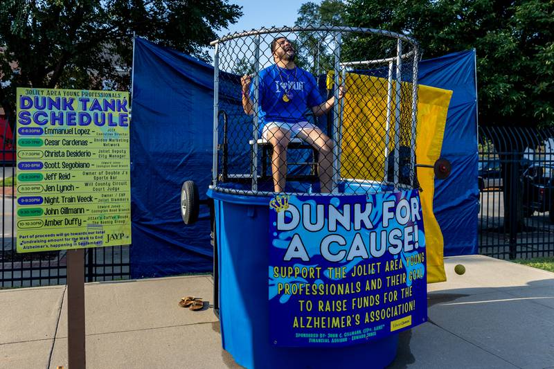 Emmanuel Lopez, Executive Director of Joliet City Center Partnership, braces for potential impact at the Dunk Tank during New Orleans North Festival at Joliet Slammers Stadium on Aug. 15, 2025.