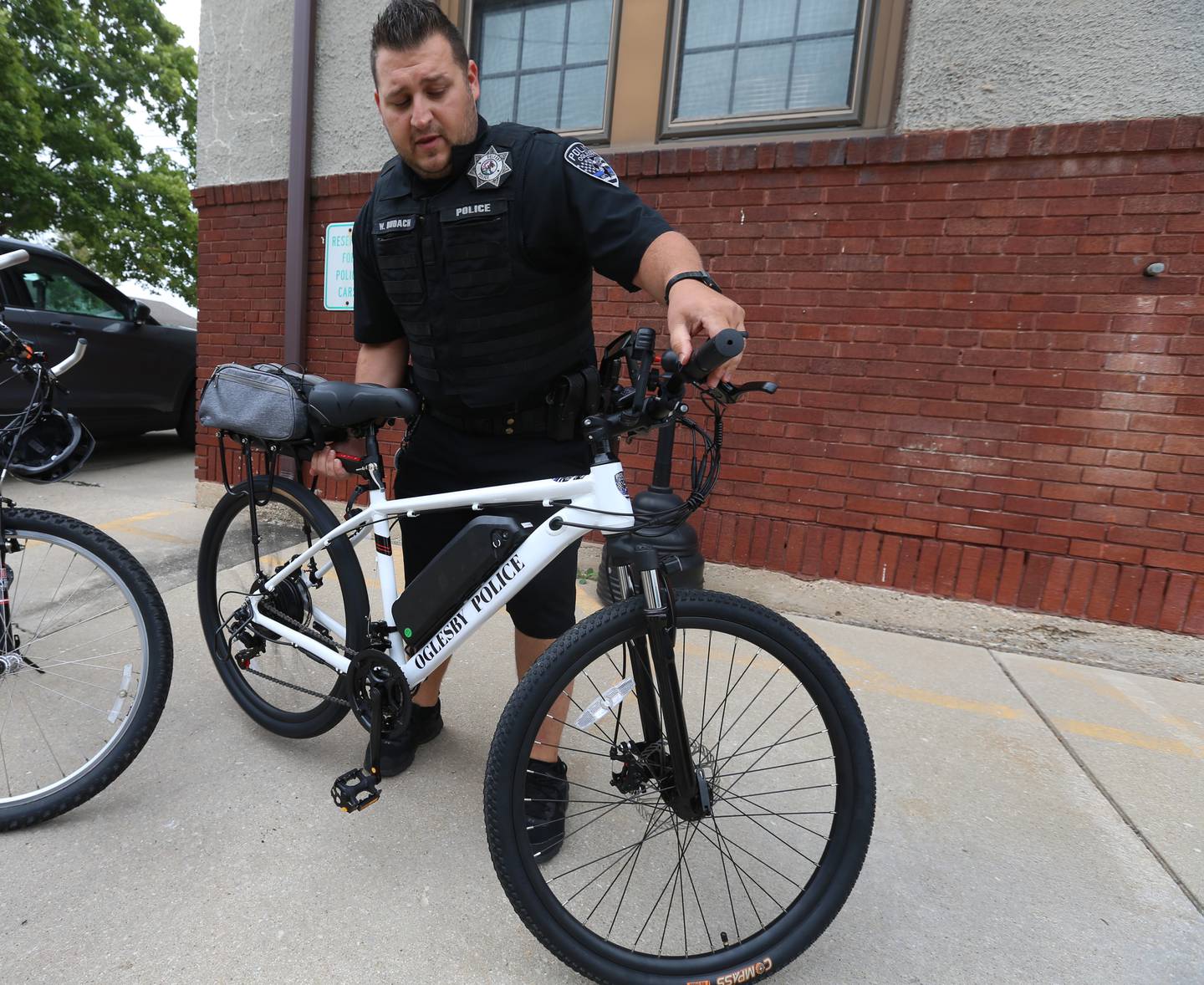 Oglesby Police officer Wes Budach prepares to ride an Ebike from the Oglesby Police Station on Wednesday, Sept. 6, 2023. The City of Oglesby has brought back it's bike patrol. The bikes will allow officers to quickly respond to law-enforcement and medical needs. It can also be used for events in town when it gets crowded.