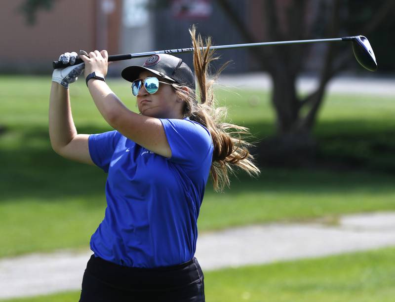 Dundee Crown’s Megan Lass watches her tee shot on the first hole during the Fox Valley Conference Girls Golf Tournament Wednesday, Sept. 21, 2022, at Crystal Woods Golf Club in Woodstock.