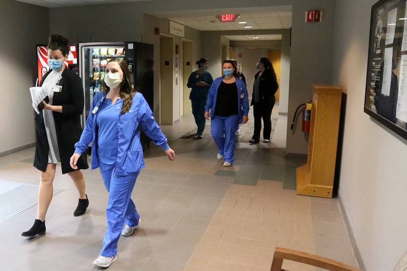 Northwestern Medicine nursing staff take a walk through the lower level of Northwestern Medicine McHenry Hospital during a brief 10-minute break created to facilitate staff resiliency on Tuesday, May 4, 2021, in McHenry.