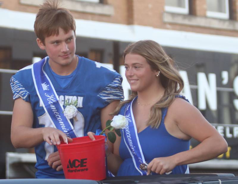 Senior court attendants Ryan Jagers and Makayla Hecht ride during the Princeton High School homecoming parade on Thursday, Sept. 25, 2025 along South Main Street in Princeton .