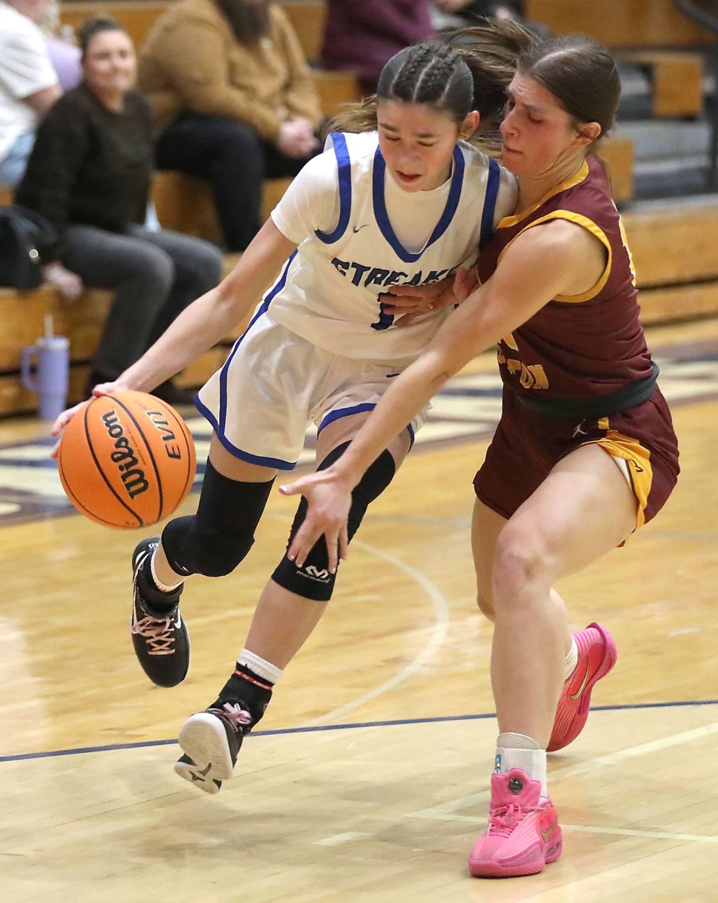Woodstock's Alex Nowacki tries two drive to the basket against Richmond-Burton's Daniella Mazzola during a Kishwaukee River Conference girls basketball game on Wednesday, Jan. 28, 2026, at Woodstock High School.