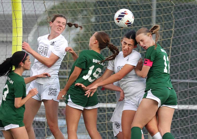 Kaneland and Boylan players go after the ball on a corner kick in front of the Kaneland net Wednesday, May 28, 2025, during their Class 2A sectional semifinal game at Belvidere High School.