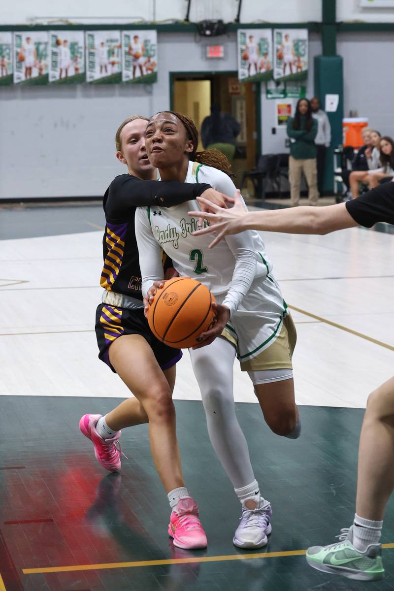 Bishop McNamara's Hailey Jackson draws a foul as she drives to the basket during the Fightin' Irish's 67-27 victory over Chicago Christian on Monday, Jan. 26, 2026.