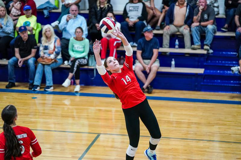 Aurora Christian's Dannon Marshall (14) sets the ball during a non-conference match against Newark at Newark High School on Tuesday, Sept. 9, 2025.