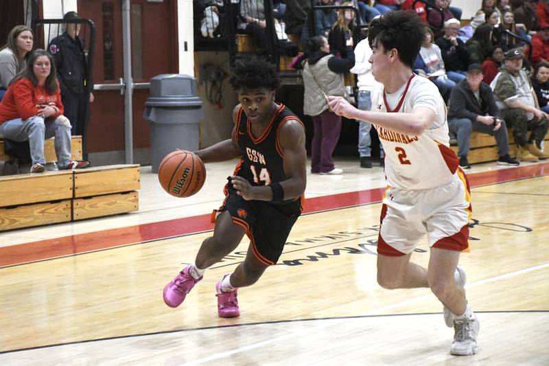 Gardner-South Wilmington's Stanley Buchanan drives towards the basket while guarded by St. Anne's Matthew Langellier during St. Anne's 52-45 victory over Gardner-South Wilmington on Tuesday, January 13, 2026.