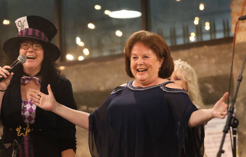 Julia Messina, NCI Artworks Executive Director, (right) reacts while being crowned “Queen of the Arts” while being introduced by Mad Hatter Jamie London during the 9th annual NCI Artworks Mad Hatter Ball on Friday, Jan. 16, 2026 at the Westclox Event Center in Peru.