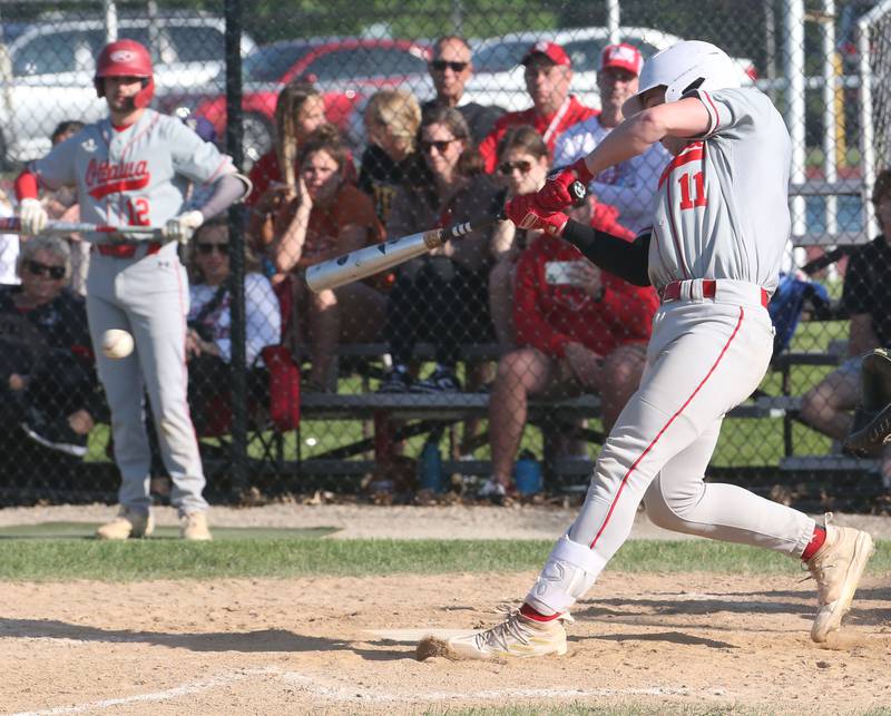 Ottawa's Adam Swanson makes contact with the ball during the Class 3A Regional semifinal game on Thursday, May 25, 2023 at Morris High School.