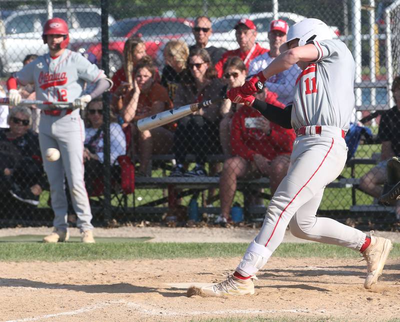 Ottawa's Adam Swanson makes contact with the ball during the Class 3A Regional semifinal game on Thursday, May 25, 2023 at Morris High School.
