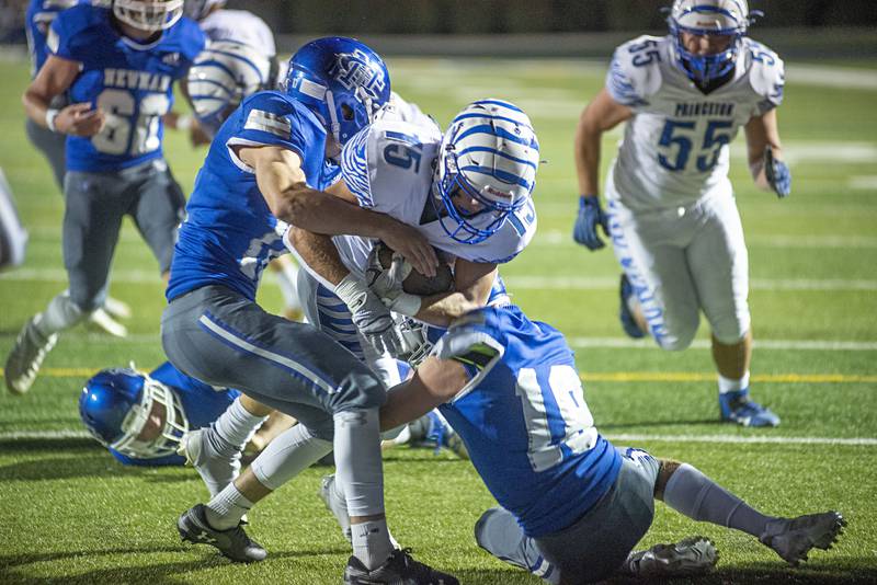 Princeton’s Augie Christiansen punches it in for a touchdown Friday, Sept. 30, 2022 against Newman.