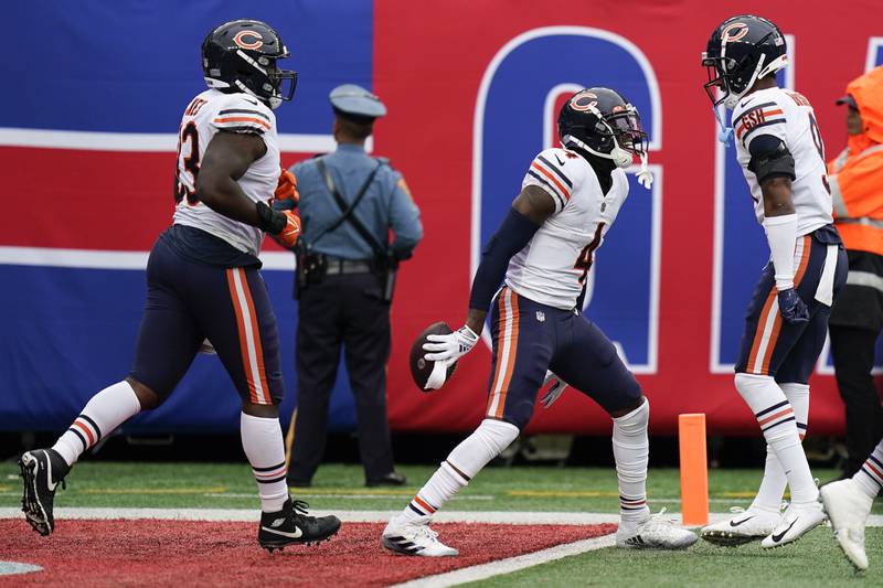 Chicago Bears safety Eddie Jackson (4) celebrates with safety Jaquan Brisker (9) after intercepting the ball against the New York Giants during the fourth quarter of an NFL football game, Sunday, Oct. 2, 2022, in East Rutherford, N.J. (AP Photo/Seth Wenig)