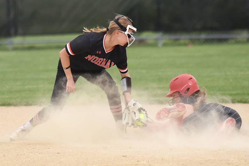 Normal Community's Bailey Engel, left, looks to apply a tag on Bradley-Bourbonnais' Shannon Lee during the Class 4A Normal Community Regional championship Friday, May 22, 2026.