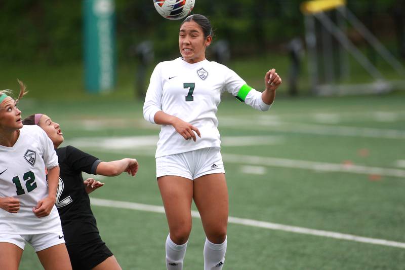 Glenbard West's Lauren Escalante heads the ball during a Class 3A Glenbard West Sectional semifinal game against Wheaton Warrenville South on Tuesday, May 27, 2025 in Glen Ellyn.