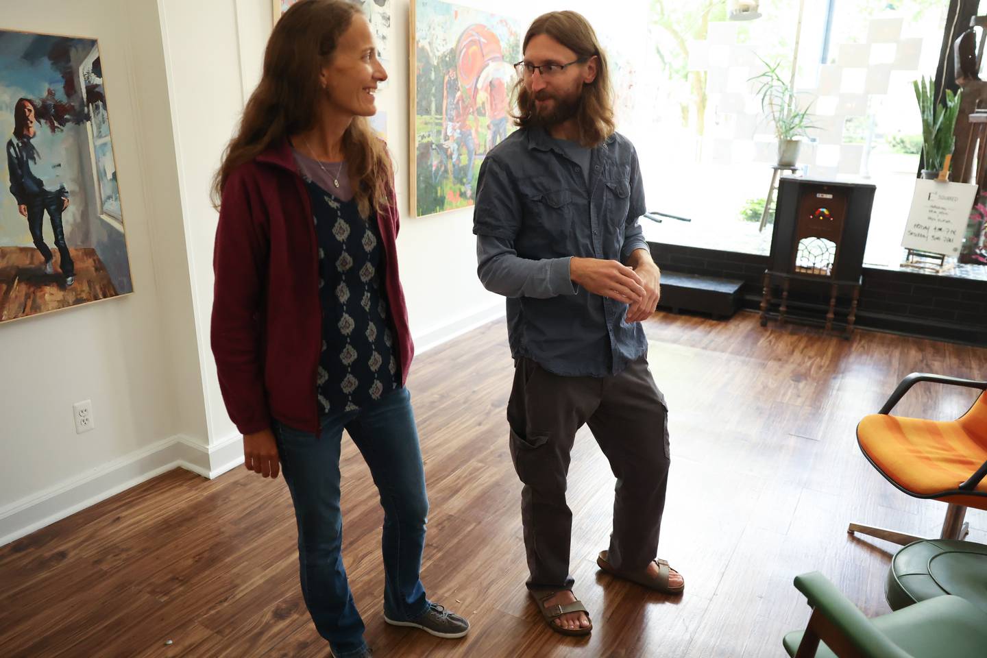 Eryn Blaser and her husband Erik Ohrn chat while at the Strange and Unusual Gallery in Downtown Joliet on Sunday, Sept. 17.