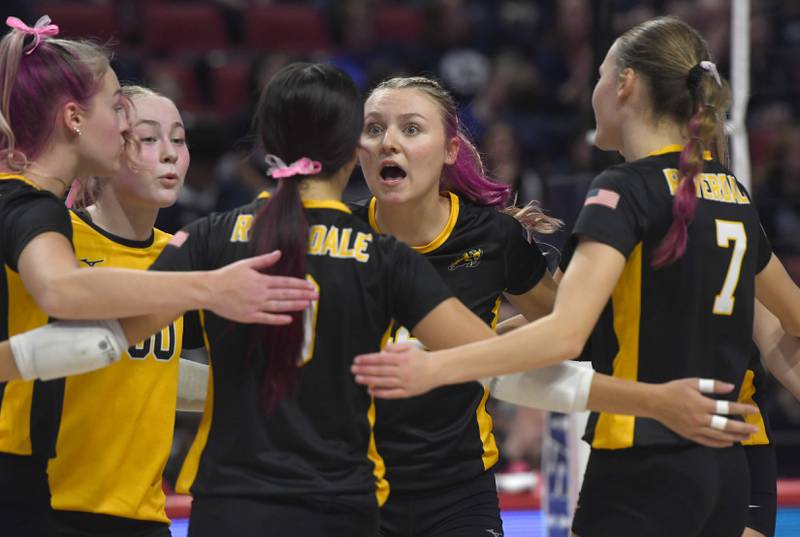 Riverdale players react to winning a point during their 2A semifinal match with Central Catholic at the state volleyball tournament at Illinois State University on Friday, Nov. 14, 2025.