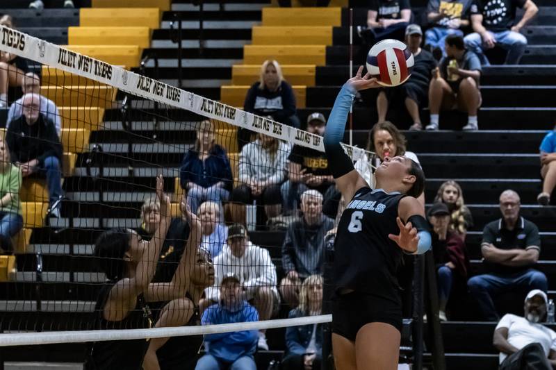 Joliet Catholic's Maggie Tibbott makes a play during the varsity volleyball game against Joliet West at Joliet West Sept. 4, 2025.