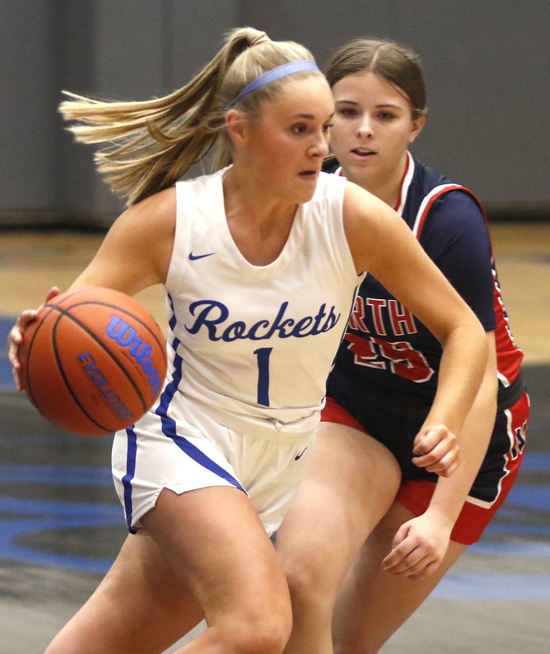 Burlington Central's Kenzie Andersen pushes the ball up the court against Belvidere North's Natalie Hix on Monday, Nov. 13, 2023, during pool play girls basketball game in the Burlington Central Mark Einwich Tournament.