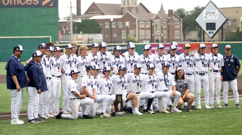 Cary-Grove’s Trojans stand with their trophy after falling to Triad in IHSA Class 3A Third Place Game baseball action at Slammer Stadium in Joliet on Saturday, June 14, 2025.